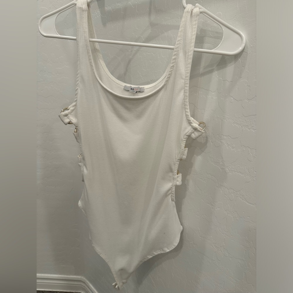 White body suit with rings going down the sides